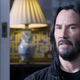 Keanu Reeves as Neo/Thomas looking dismayed at a therapy appointment in the trailer for Matrix Resurrections.